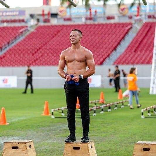 Jake at an outdoor stadium training event